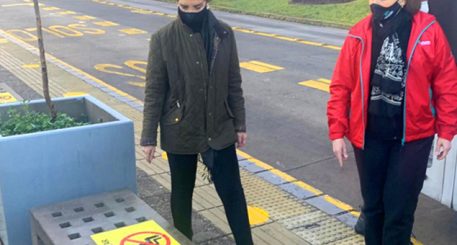 Minister Gloria Hutt at a bus stop